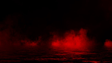Mystic red smoke on the floor. Fog isolated on black background.Reflection on water.