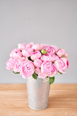 Pink Angel Cheeks peonies in a metal vase. Beautiful peony flower for catalog or online store. Floral shop concept . Beautiful fresh cut bouquet. Flowers delivery