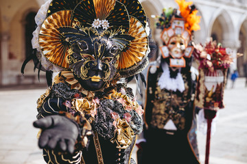 Portrait of a couple with beautiful masks in Venice, Italy