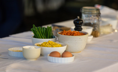 Big table of different plates of vegetables and healthy food