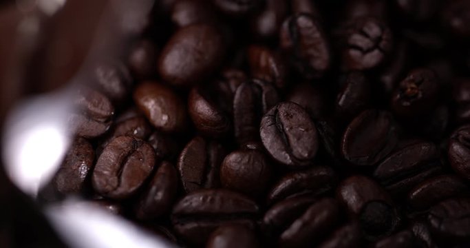 macro coffee beans in a package in slow motion. Raw coffee 