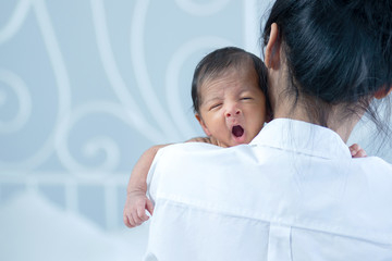 Asian mother is carrying her child, Felt warm and loved, newborn baby and concept