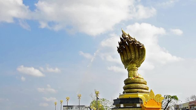 Yard serpent spits water on the Mekong River in Nakhon Phanom, Thailand for foreign traveler and thai people travel visit and respect praying