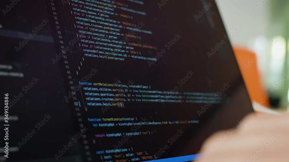 Wall mural writing code on laptop. software developer writes code from home. remote work and freelance concept.