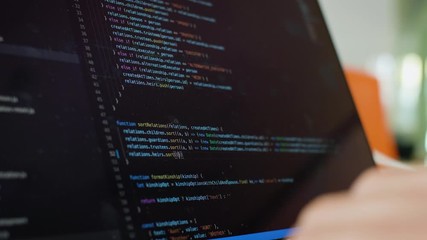 Writing code on laptop. Software Developer writes code from home. Remote Work and Freelance Concept. - Powered by Adobe