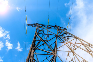 High voltage electric pillar from under. A high-voltage electricity tower