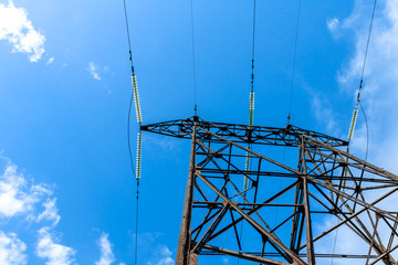 High voltage electric pillar from under. A high-voltage electricity tower