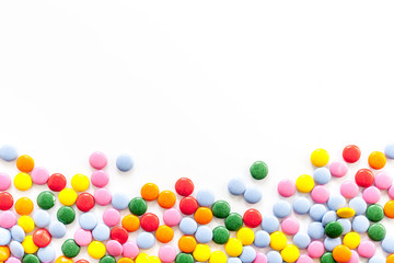 Color candy on white tabe top-down frame space for text