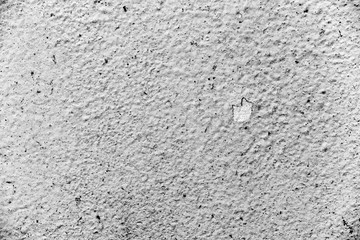 Texture of a concrete wall with cracks and scratches which can be used as a background