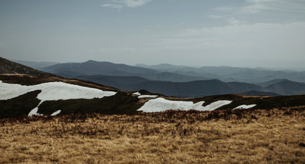View to snowy spring mountains