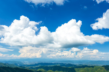 Fototapeta premium Beautiful landscape clouds in blue sky over green mountain forest nature, nature view, Save the environment.
