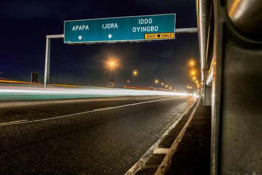 freeway exit sign at night in Lagos