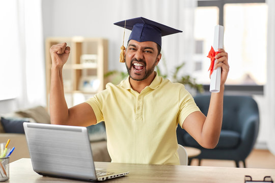 E-learning, Education And People Concept - Happy Smiling Indian Male Graduate Student With Laptop Computer And Diploma Celebration Success At Home