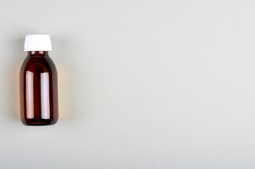 Hand sanitizer in glass bottle.