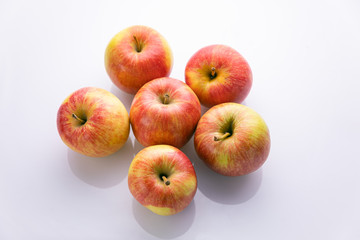 Ripe, red apples on a white background. Farm fruits