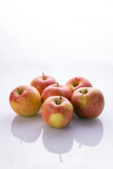 Ripe, red apples on a white background. Farm fruits