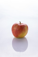 Ripe, red apples on a white background. Farm fruits