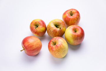Ripe, red apples on a white background. Farm fruits
