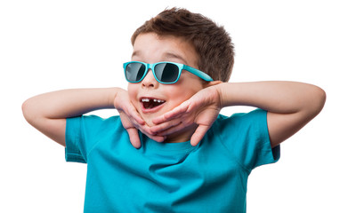 Cheerful little boy in sunglasses express surprised face, isolated on white background