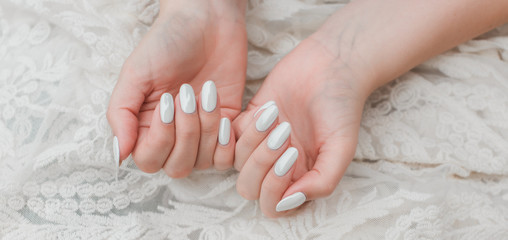 Wedding white pearl manicure, close up, beauty details 