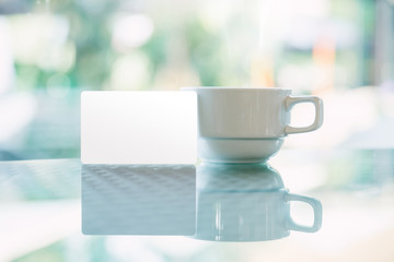 mock up of credit card put near coffee cup