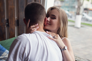 Surprise! Beautiful romantic couple in cafe. Young man is coming of the date to his beloved in caffe. Feel of happiness.