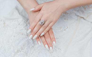 Obraz na płótnie Canvas White classical pearl manicure, close up, beauty details