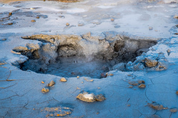Crowd of smoking chimneys and puddles of boiling water in Hverir, Iceland.