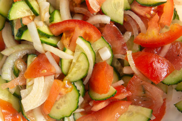 Fresh salad with tomatoes, cucumbers and onion.