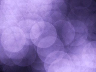 bokeh of lights on Purple and black background