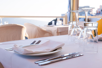 Open restaurant terrace with amazing sea view on Santorini island. Cyclades, Greece