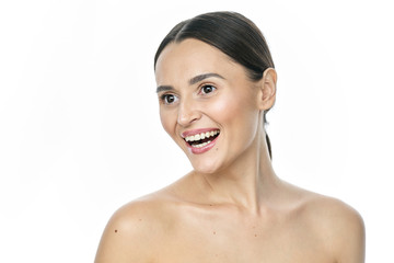 Headshot Portrait of happy girl with freckles smiling looking at camera. White background.