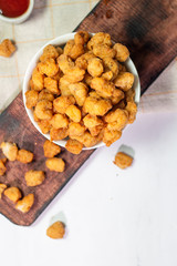 Stock photo of Homemade Crispy Popcorn Chicken with Sauce on white background