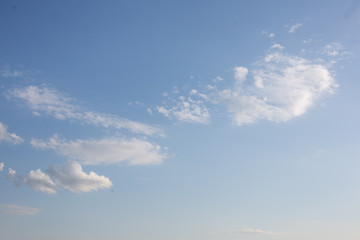 Fluffy white tender spring clouds in warm weather.