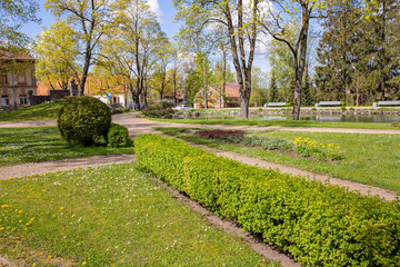 City, Cesis, Latvia. Old historic park in spring with greenery.