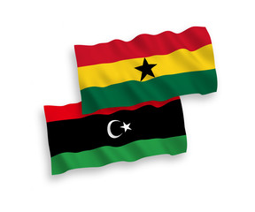Fototapeta premium National vector fabric wave flags of Ghana and Libya isolated on white background. 1 to 2 proportion.