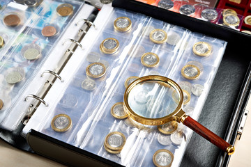 Numismatic coins with magnifying glass