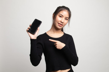 Young Asian woman point to mobile phone.