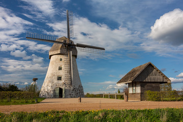 Fototapeta na wymiar Cit Araisi, Latvia. Old historic windmill and nature.