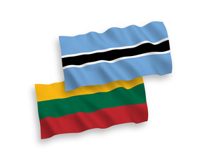 National vector fabric wave flags of Lithuania and Botswana isolated on white background. 1 to 2 proportion.