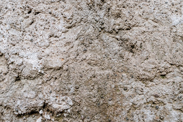 Old dirty wall uneven texture. Vintage or grungy white background of natural cement & stone texture as retro pattern wall. It is a concept design. Metaphor banner, material aged, rust or construction.