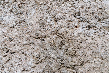 Old dirty wall uneven texture. Vintage or grungy white background of natural cement & stone texture as retro pattern wall. It is a concept design. Metaphor banner, material aged, rust or construction.