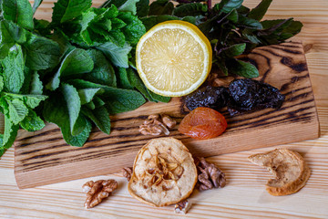 Fruits and kitchen herbs still life in the kitchen