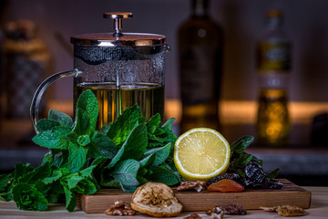 Fruits and kitchen herbs still life in the kitchen