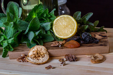 Fruits and kitchen herbs still life in the kitchen