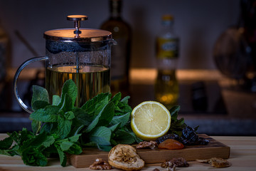 Fruits and kitchen herbs still life in the kitchen