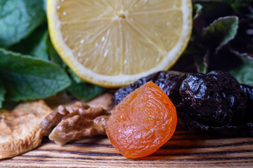 Fruits and kitchen herbs still life in the kitchen