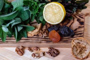 Fruits and kitchen herbs still life in the kitchen