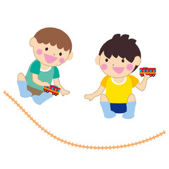 電車のおもちゃで遊ぶ男の子たち
