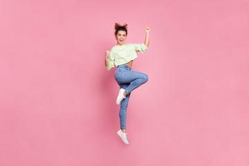 Fototapeta premium Full length body size view of her she nice attractive lovely pretty slender energetic cheerful cheery girl jumping rejoicing having fun isolated over pink pastel color background